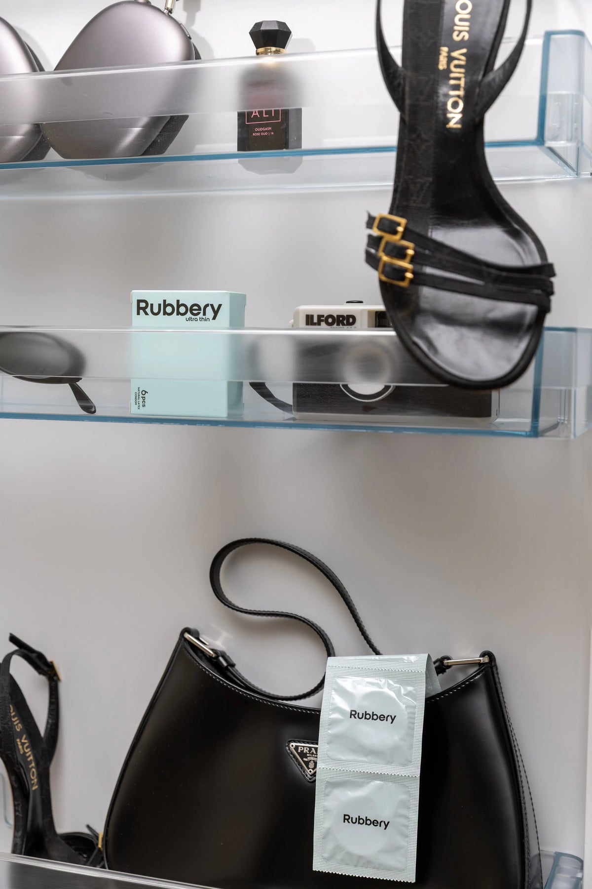 Rubbery condoms displayed in a lifestyle setting on glass shelving.