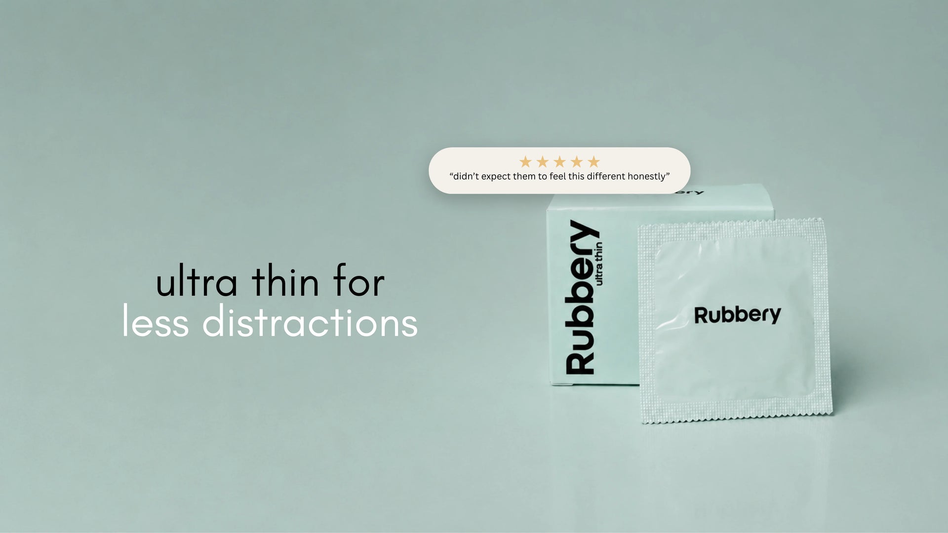 Rubbery Ultra Thin condoms box and wrapper on a pale blue background